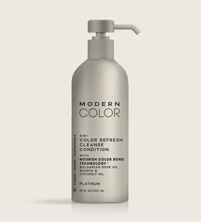 Product image of a light platinum-colored bottle labeled Modern Color 3-in-1 Color Refresh: Cleanse, Condition, and Nourish with Bulgarian Rose Oil, Quinoa, and Coconut Oil. Features Nourish Color Bond Technology for Platinum color hair.